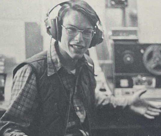 Tom Hiscox, former AHS student in the 1970s, taking a break on his radio show. 