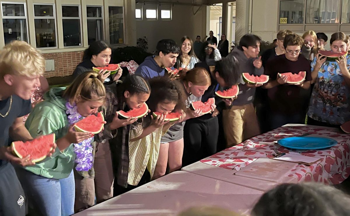 students participating in the watermelon eating contest