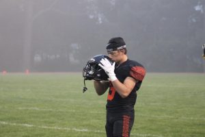 Jackson Strand kissing his helmet before the game