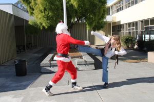 Santa Claus and JSU president Dinah Sullivan illustrate the friendly rivalry between religious holidays.