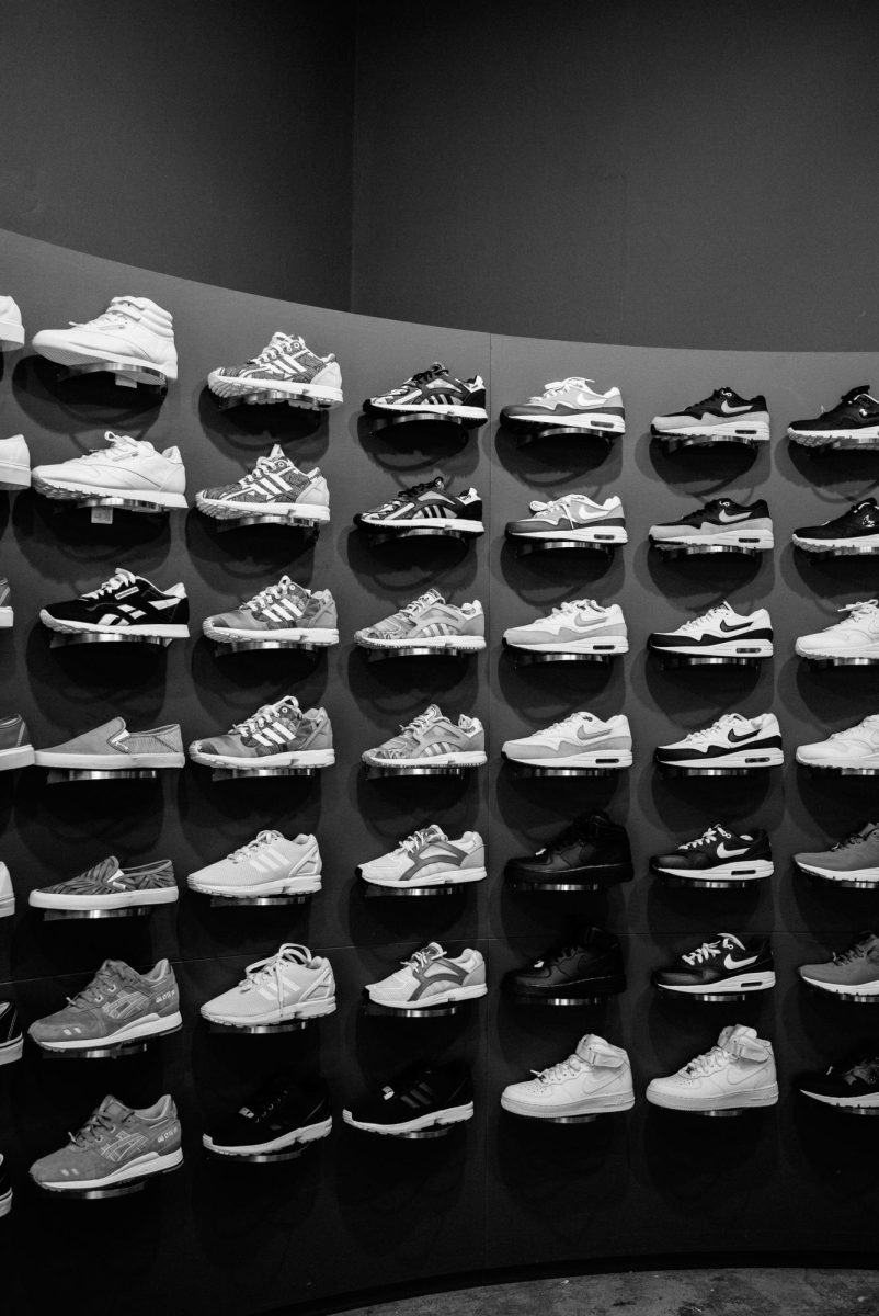 A large display of black and white sneakers