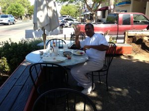 Troy eating at a diner in Ukiah after being released. This was his first time using metal silverware in 27 years. 
