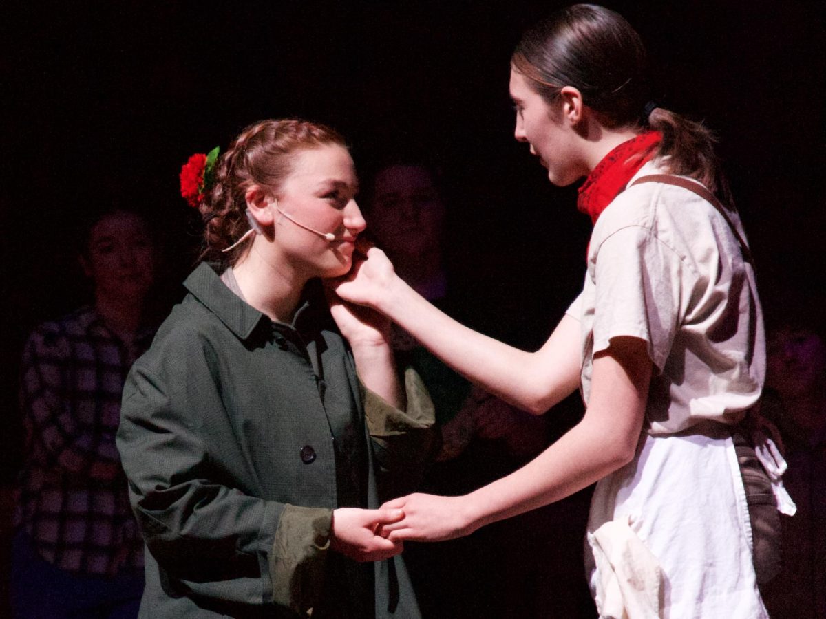 Grace Humphreys and Sabine John as Eurydice and Orpheus in Hadestown: Teen Edition. 