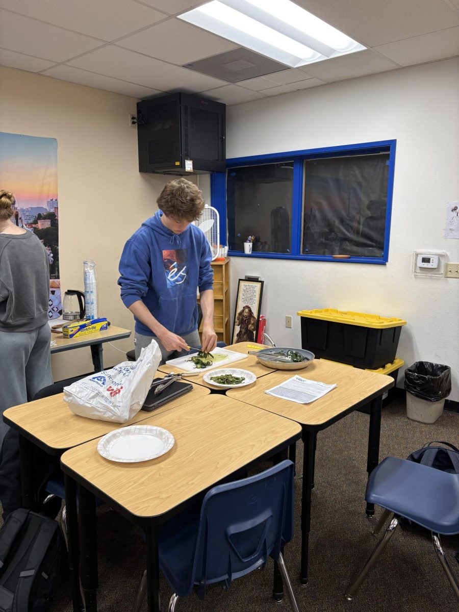 Spanish student preparing pimiento peppers. 
