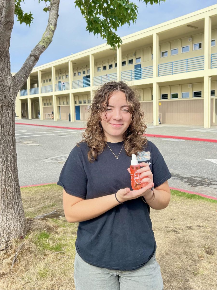 Senior Anna Clarke holding her perfume