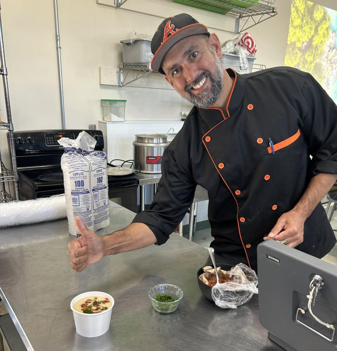 Chef Kalson plating food.