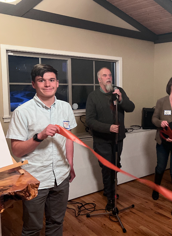 Adams cutting the ribbon of a new Trinidad business.