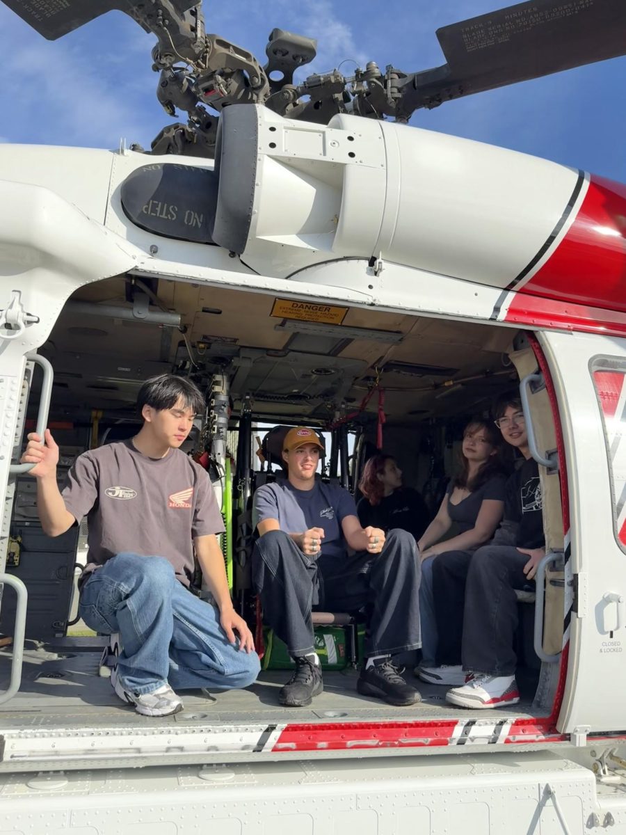 Students sitting in a helicopter at the career fair.