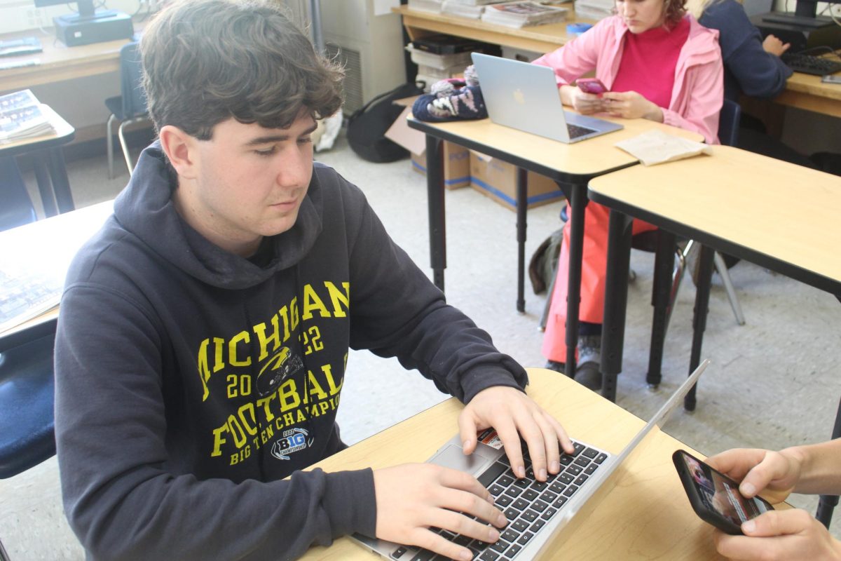 Thomas FitzMaurice looking at his UC Santa Cruz application.