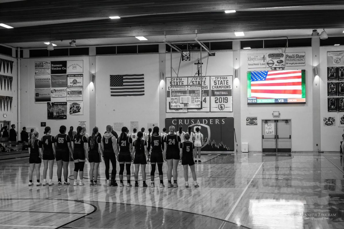 Arcata Women's team lined up for the national anthem. 