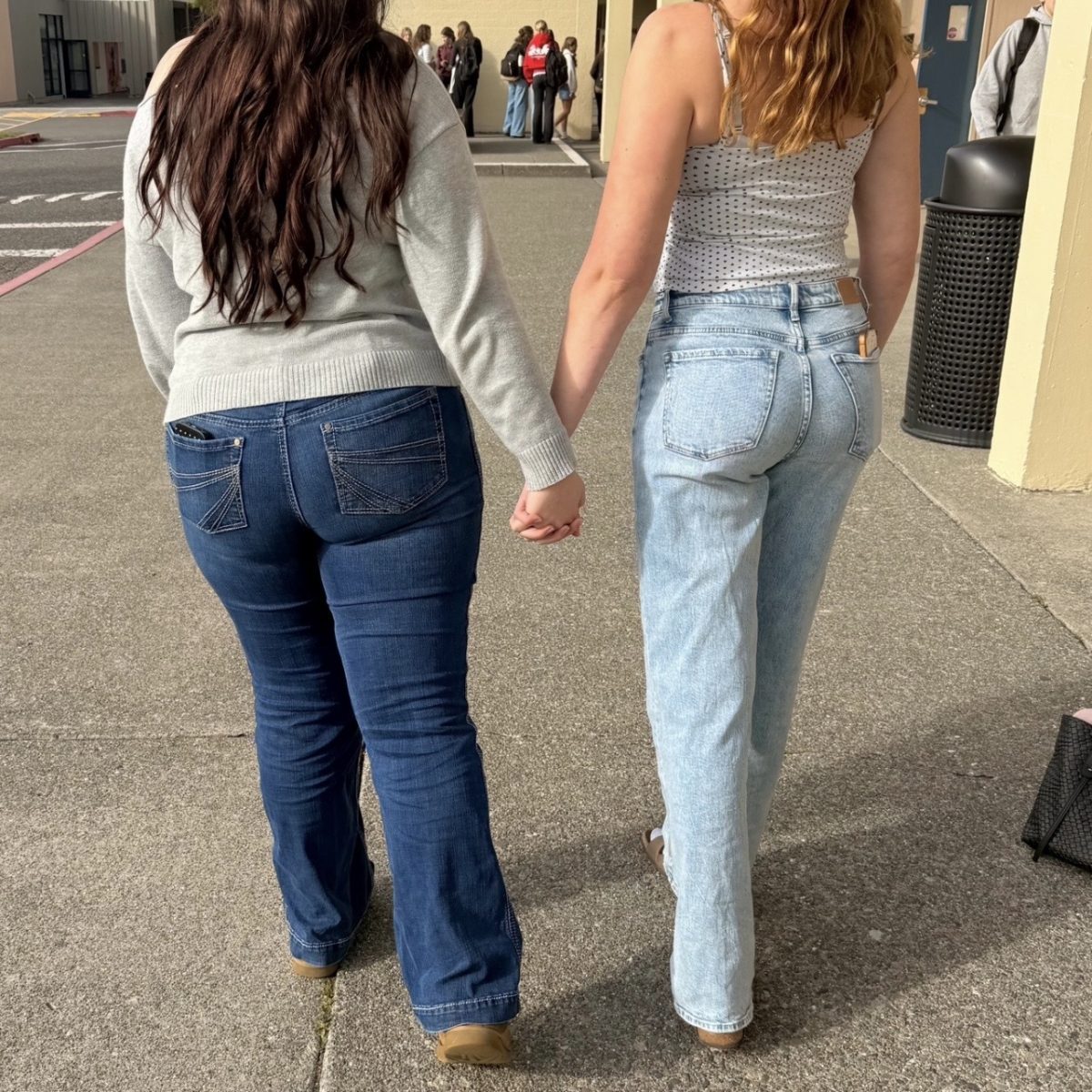Two students holding hands