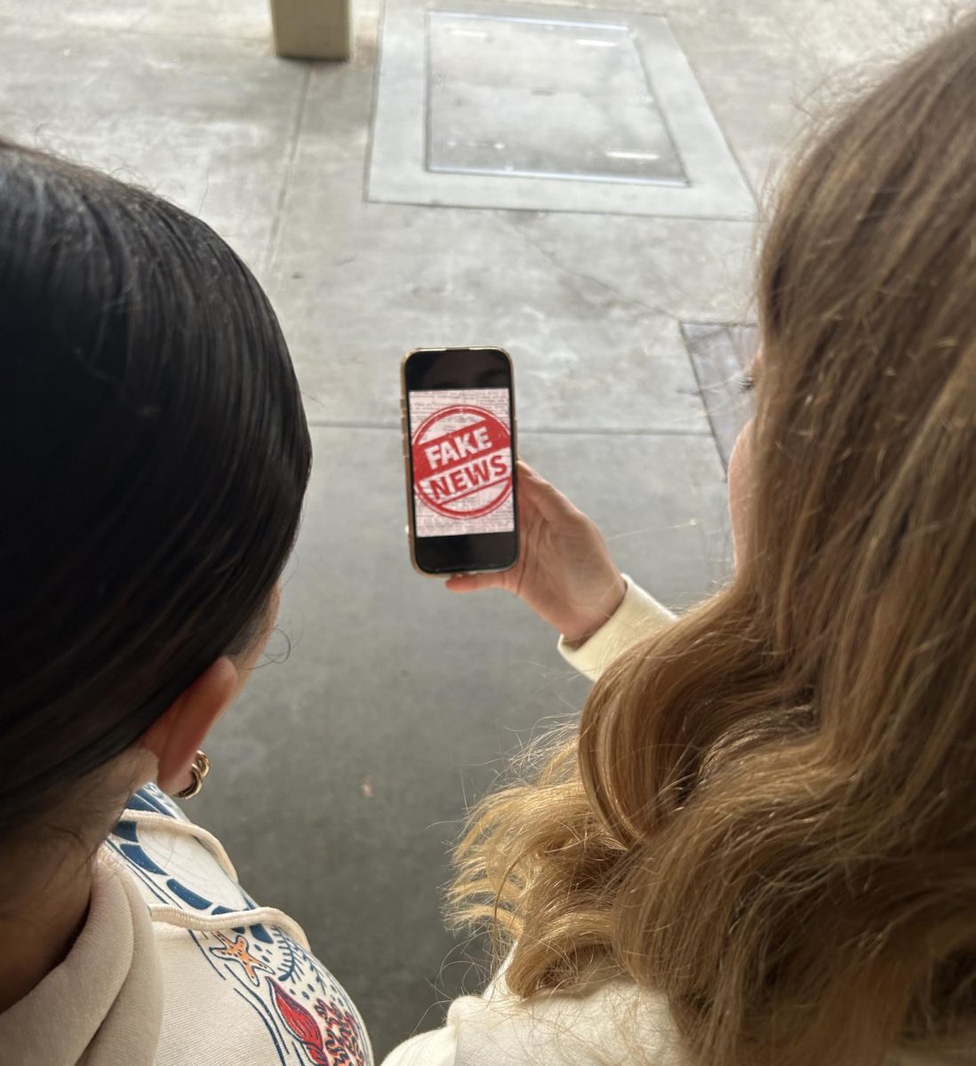 Students reading fake news.