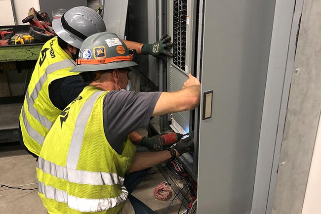 Electricians working on site. 