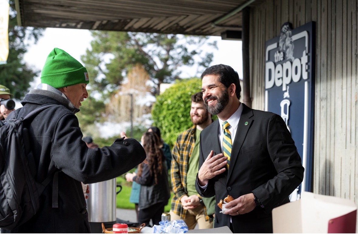 Carvajal mingling with students and handing out donuts on his first day as president. 