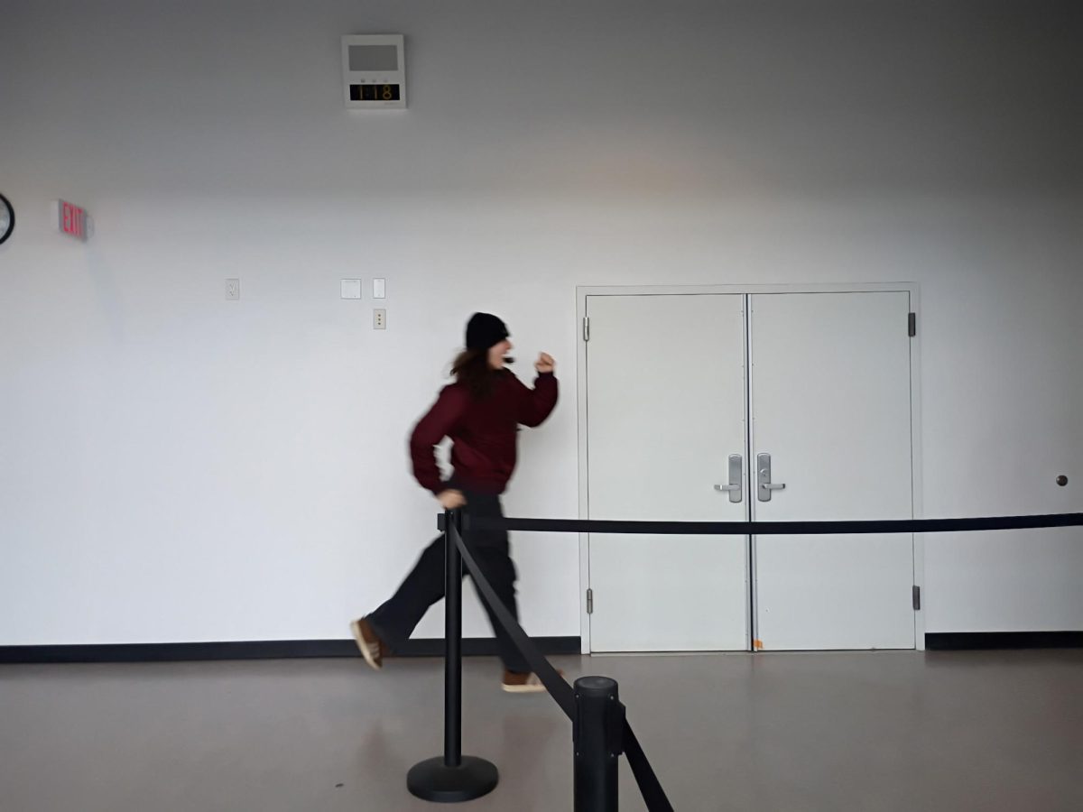 Student runs to lunch line.
