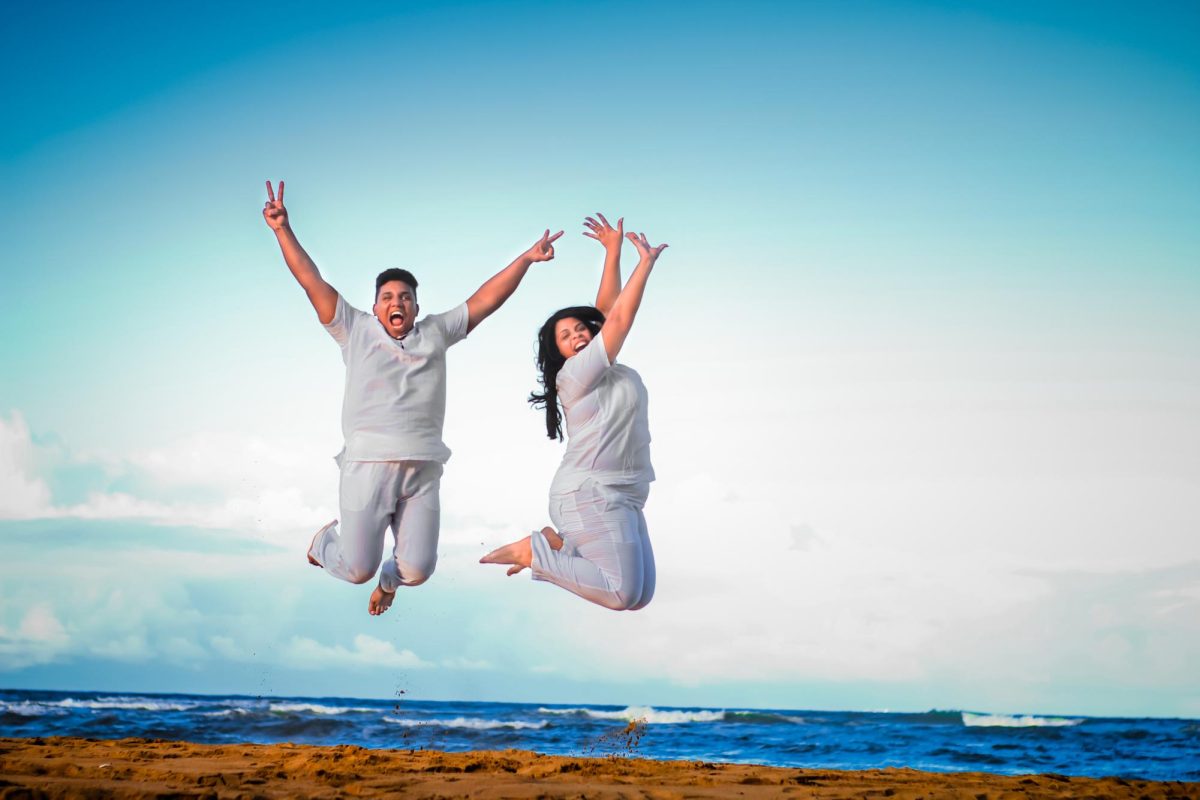 Joyous Couple jumping in joy.